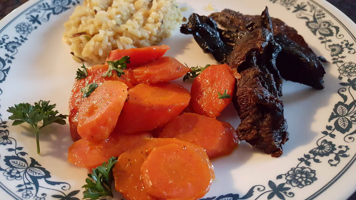 Smoked Slow Bear on plate served with fresh vegetables and other sides